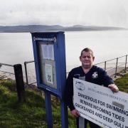 Ulverston Inshore Rescue station officer Bruce Chattaway with the new tide information display at Canal Foot...JON GRANGER.