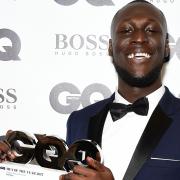 Stormzy with his Copper Dog Whiskey Solo Artist award (Ian West/PA)