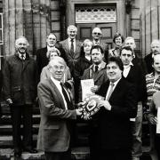 MP for Carlisle Eric Martlew presenting the Cumbria in Bloom Westmorland Gazette Shield, to chairman of the East Cumbria Health Health Committee Ian Carr in 1992