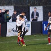 Ben Thomas and Steven Yawson celebrate with Scott Harries after he scored for Kendal