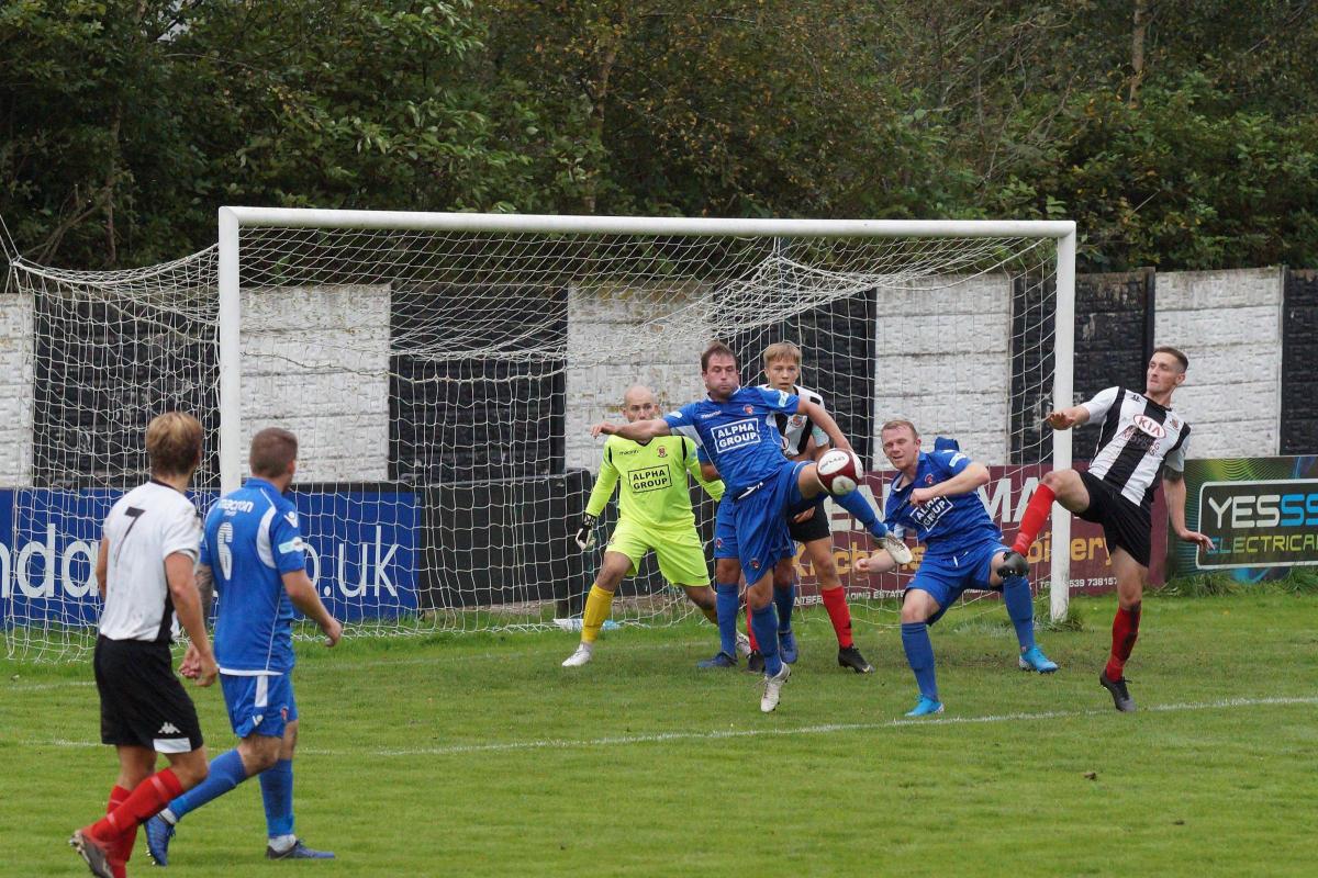 Nathan Cloudsdale, right, in goalmouth action against Droylsden