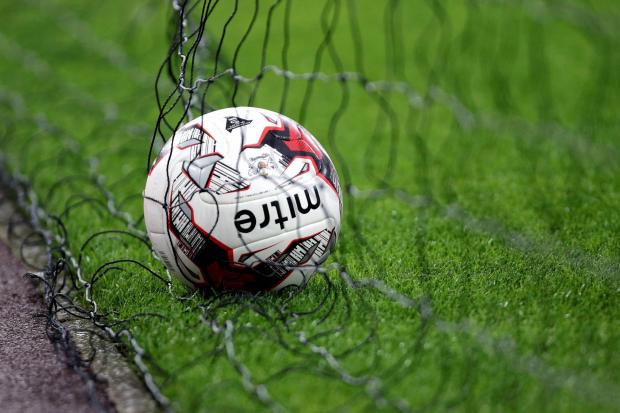 File photo dated 25/08/15 of a view of a football in the back of a net. MSPs will quiz football association bosses on progress to improve child protection in the sport when they return to Holyrood today. PRESS ASSOCIATION Photo. Issue date: Tuesday