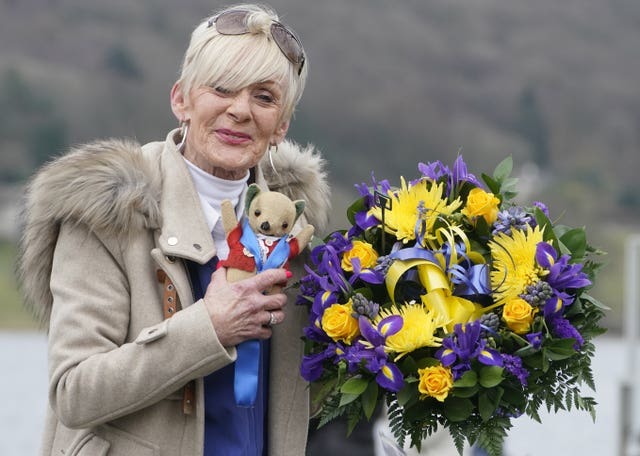 FLOWERS: Gina Campbell holding Mr Whoppit. Picture: Owen Humphreys/PA