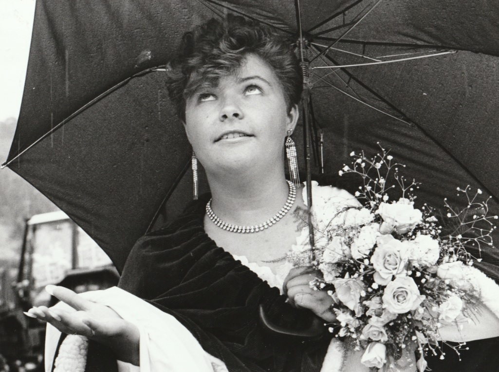 Allithwaite Carnival Queen Samantha Bird checks for rain in 1988
