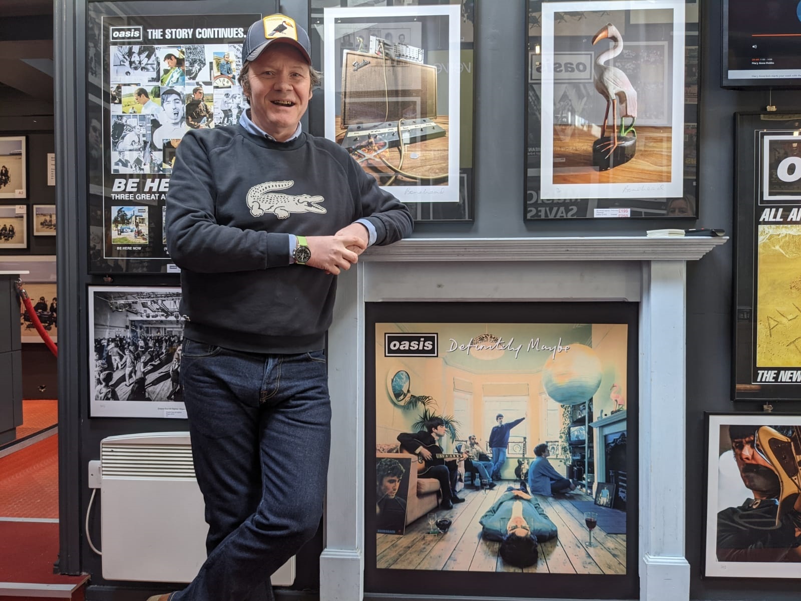 EXPANSION: Brian Cannon inside the Microdot Boutique next to the fireplace that featured on the front cover of Definitely Maybe
