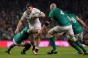 England's Mark Wilson gets tackled during the Guinness Six Nations match at the Aviva Stadium, Dublin..