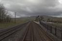 The driver's cab view approaching Ribblehead Viaduct. Reportedly, the pole on the left snapped causing the wires to drop down onto the tracks. (Credit: British Transport Police)