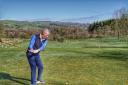 New club captain John Sherlock drives off using a ceremonial hickory-shafted club at Kirkby Lonsdale Golf Club