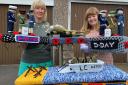 Elaine Wright and Tracy Johnson show off their knitted masterpiece to commemorate 80 years since D-Day