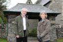 SKELSMERGH WW1 HERITAGE LOTTERY GRANT.  Pictured are Tony Cousins, Parish Historian, and Helen Atkinson, Church Warden beside the lychgate of the Church of St. John the Baptist, Skelsmergh - the church council has been awarded £5900 from the Heritag