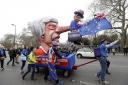 PROTEST: Demonstrators pull a cart with a doll resembling British Prime Minister Theresa May during a Peoples Vote anti-Brexit march in London