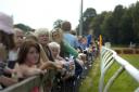 DAY AT RACE: Punters watch the horses