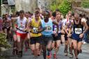 Wegene Tafese leads the pack in the senior men's Inter-Counties fell race. Photo by Dave Woodhead of woodentops.org.uk