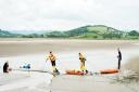 Rescuers begin the delicate job of making their way out to the couple trapped at Sandside