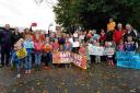Parents and children demonstrate about nursery closures