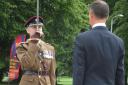 Lieutenant Colonel Gareth Walker of the Royal Engineers receives the sword of peace