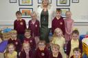Headteacher Alex Moore with pupils at St James' C of E Infant School following their glowing Ofsted report