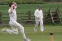 Shireshead's Dave Jack on his way to a seven wicket haul