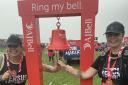 Gill Simkiss and her daughter Imogen Bonwick ringing the bell after completing The Great North Run