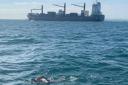Ian Bury swims alongside a tanker in the English channel