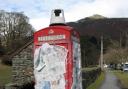 PAPERED: One of the phone boxes