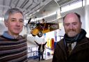 LITTLE WONDER: Ken Atkinson (left) with the Flying Flea he restored with museum director Bill Bewley with Edwin Maher