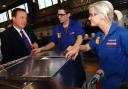 David Cameron (left) with sheet metal apprentices Daniel Martin and Clare Harris. Photo supplied by North West Evening Mail.