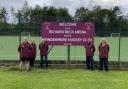 PROUD: Coaches Alastair Boston, Shona Taylor, Richard Belk, Jeff Jackson and Mark Kendrick stand by the new sign