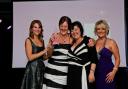 Jane and Denise picking up their prize at the EVA awards