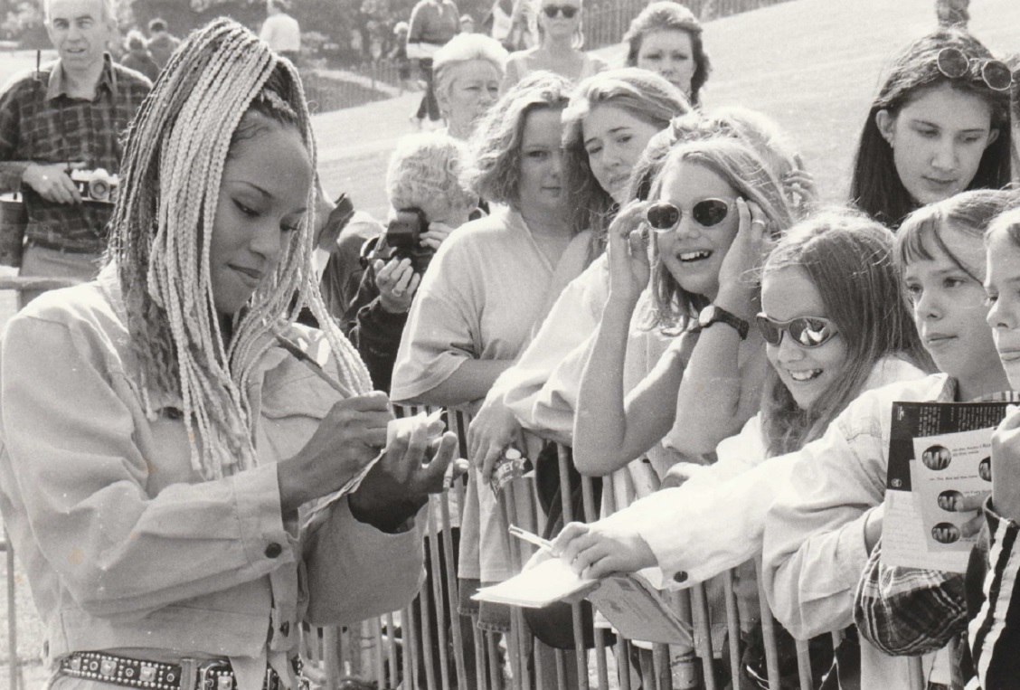 A Tony Tee dancer signs autographs at the roadshow in 1996