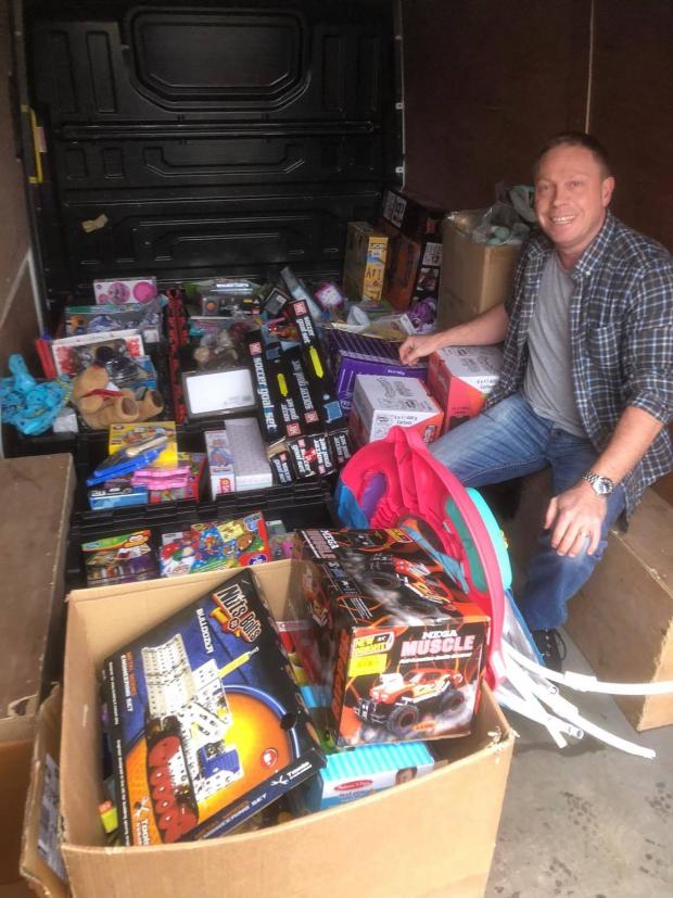 The Westmorland Gazette: PROUD: Mr Miller collecting the toys to take to Women's Community Matters