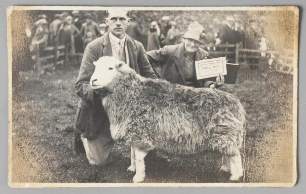 The Westmorland Gazette: FARMING: Tom Storey and Beatrix Heelis with prize-winning ewe , 26 September 1930. Photographic print, published by the British Photo Press. © National Trust