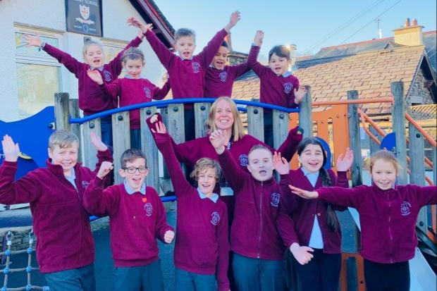 CELEBRATING: Headteacher Lucy Bone and pupils from St Cuthbert's Catholic Primary School