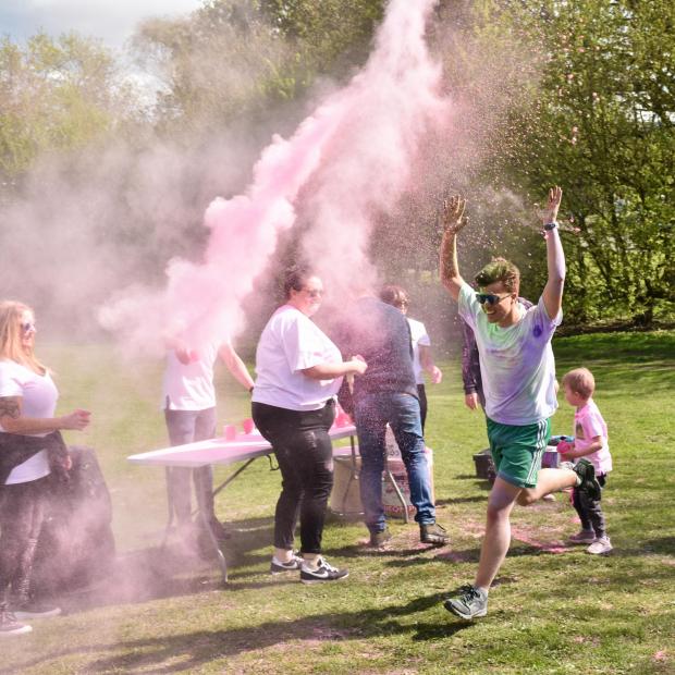The Westmorland Gazette: COLOUR: Runners were covered in colourful paint- Picture: Keith Douglas