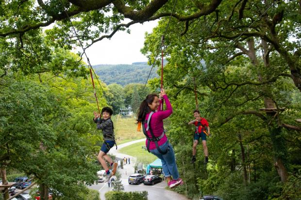 ZOOM ZOOM: Children enjoying the zip line at Treetop Trek