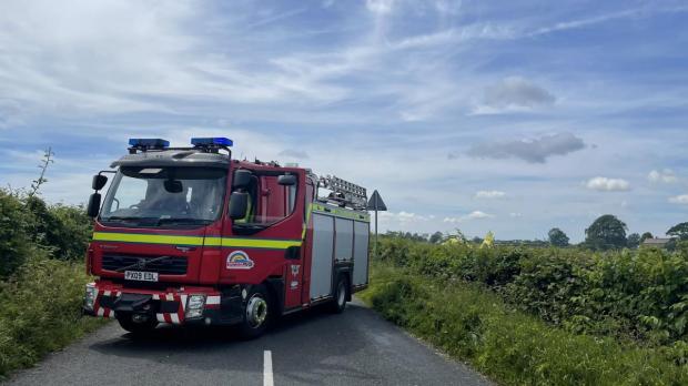 The Westmorland Gazette: INVESTIGATION: A fire engine blocks the road