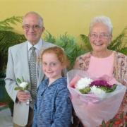 Kerenza Lentell presented flowers to Tony and Joan Jackson as they opened Bolton-le-Sands Horticultural Society's 91st Annual Summer Show