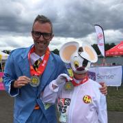 Will Taylor and his dad Sam dressed as Danger Mouse and Penfold at the Superhero Triathlon