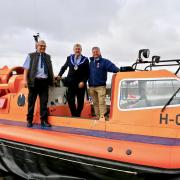 Mike Guy, chairman of the lifeboat management group, assistant provincial grand master Keith Beamont, and Steve Wilson, lifeboats operations manager, standing onboard the Morecambe RNLI hovercraft rescue vessel (Picture: Brian Ferrington)
