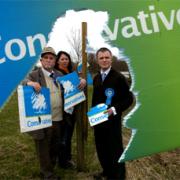 UNHAPPY: Conservative Parliamentary Candidate Gareth McKeever (right) and supporters Roger Bingham and Rachel Kane with some of the torn up election posters