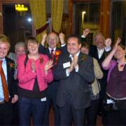 DELIGHTED: Jubilant Labour supporters celebrate after holding Barrow and Furness