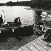 Catherine Allard, general manager of the Windermere Steamboat Museum, helps moor the steam launch Suilven during the annual rally of the Steamboat Association of Great Britain, at Windermere, in 1995