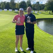 Zoe Wilson with Mike Turner, the men's champion and director of golf at Carus Green.