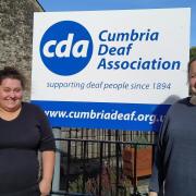Nicola Alloway, sign language interpreter (left) with Lucy Belton support coordinator (right) outside Cumbria Deaf Association