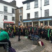 Choir pictured performing in Kendal at The Street Choirs Festival