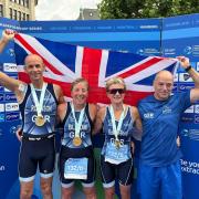 Stuart Robinson (left), Linda Bond,  Claire Bloom and Keith Tannetta (right) pictured with their medals for the Mixed Sprint 60-69 Age Relay at the World Triathlon Championship Series in Hamburg