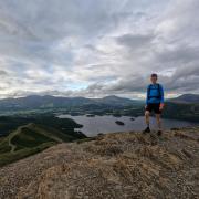 Alex Staniforth summiting Catbells - a fell in the Lake District-