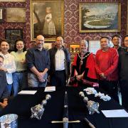Mayor Kendal Cllr Julia Dunlop (red gown centre) welcoming Chinese guests from Jiangbei District to the Mayor’s Parlour, accompanied by Town Clerk, Chris Bagshaw (4th left) and Steve Scott (left)
