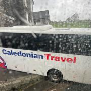 The Caledonian Travel coach wedged outside Windermere Hotel