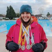 Victoria poses with her four medals
